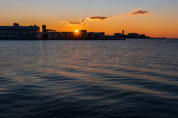 Obraz premium Sunset from the Audace pier of Trieste. Colors of fire on the water. Italy
