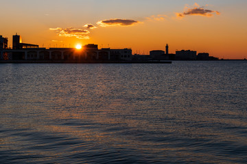 Obraz premium Sunset from the Audace pier of Trieste. Colors of fire on the water. Italy