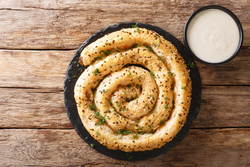 Borek also burek baked filled feta pastries made of a thin flaky dough closeup on the table. Horizontal top view