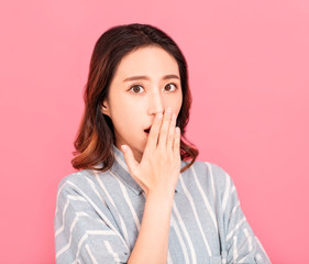 young woman  hands covering her mouth