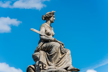 Fototapeta na wymiar La Seine statue by Louis Petitot on the Pont du Carrousel in Paris, a historic monument in Paris, France. A central landmark of the Paris city.