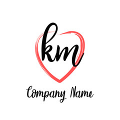 KM initial handwriting in a love brush-shaped template