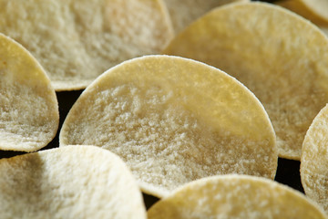 Potato chip on black background 