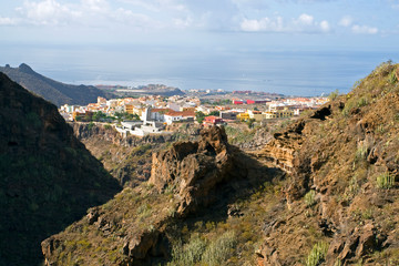 Fototapeta na wymiar panorama of a small Spanish city in Tenerife from above near the sea, natural background