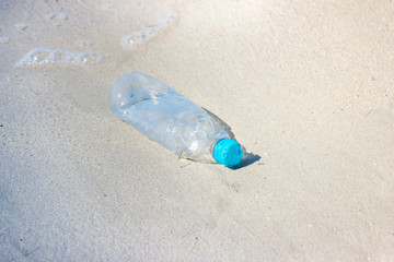 garbage and plastic bottles and dirty waste on a beach, Concept Campaign to stop using plastic bottles