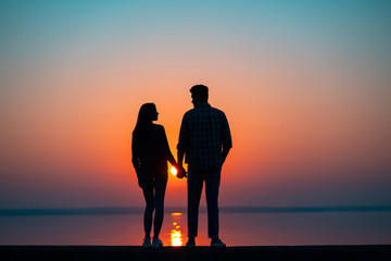 The couple against the beautiful sunset