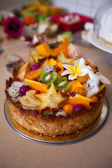 Cake with fresh fruits kiwi dragon fruit papaya mandarin carambola