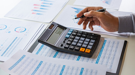 businessman working calculate data document graph chart report marketing research development  planning management strategy analysis financial accounting. Business office concept.