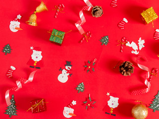 Christmas objects on red background.