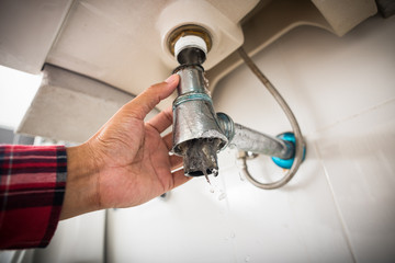 clogged and leaky sink sewer