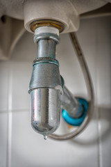 clogged and leaky sink sewer