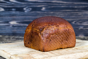 a whole loaf of black rye bread