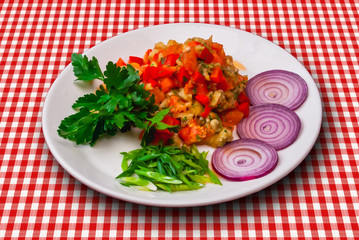 Appetizer vith red vegetables, onion and green parsley