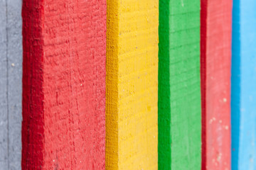 Decorative fence painted in rainbow colors.