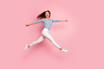 Fototapeta na wymiar Full length body size photo of cheerful side profile crazy running jumping girlfriend expressing emotions on face isolated pastel color backgrond