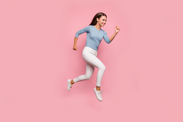 Fototapeta na wymiar Turned full length body size photo of cheerful positive cute nice pretty girl jumping running in white footwear smiling toothily isolated pastel color background