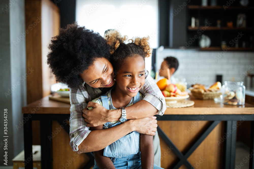 Wall mural happy mother and children in the kitchen. healthy food, family, cooking concept