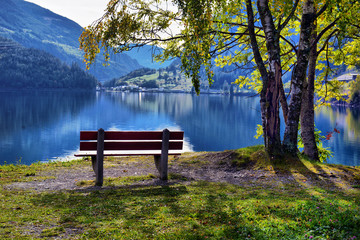 beautiful view of a mountain lake in the autumn sunny day. Poschiavo, Switzerland