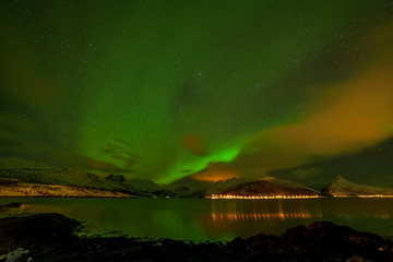 Amazing northern lights, Aurora borealis over the mountains in the North of Europe - Lofoten islands, Norway