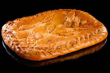 homemade apple pie on a black background