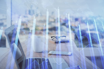 Stock market graph and table with computer background. Double exposure. Concept of financial analysis.