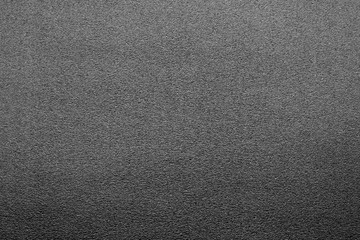 Plastic glittering texture with blur effect in black and white.