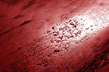 Metal rough surface in red tone.
