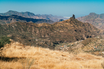 View of Roque Nublo, Tejeda on Gran Canaria island. Highest mountain peak located in  Nublo Rural Park, hiking trail for tourist adventure. Dessert, scenic view, hot summer, volcanic mountains