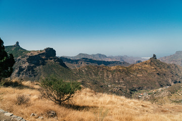 View of Roque Nublo, Tejeda on Gran Canaria island. Highest mountain peak located in  Nublo Rural Park, hiking trail for tourist adventure. Dessert, scenic view, hot summer, volcanic mountains