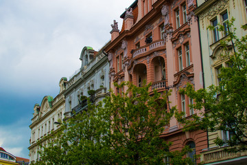 Facade of a typical colorful classic building in a street in middle of Prague, Czech Republic