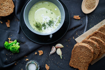 green cream broccoli soup with rye bread. 