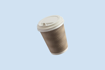 Paper cup with coffee flying in the air on a light blue background. Coffee shop concept. Levitation