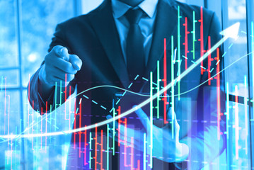 Chart direction up trend and volume with background  business man point finger.