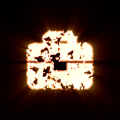 Symbol briefcase burned on a black background. Bright shine