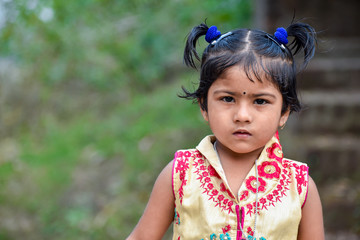 A cute little girl is surprised and looking