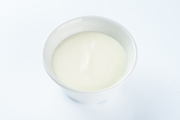 Fototapeta na wymiar mayonnaise in a bowl on a light background