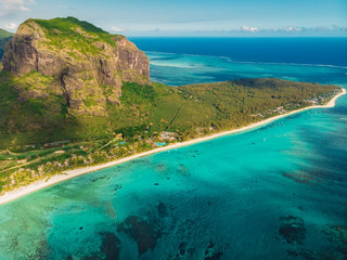Tropical island with Le Morne mountain, blue ocean and beach in Mauritius. Aerial view