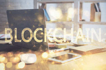 Multi exposure of blockchain theme hologram and table with computer background. Concept of bitcoin crypto currency.