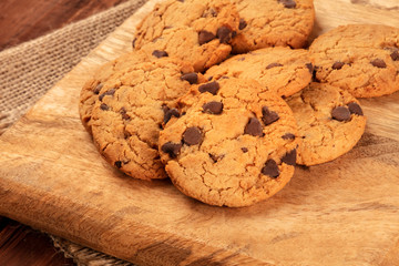 Gluten-free chocolate chip cookies close-up on a rustic background