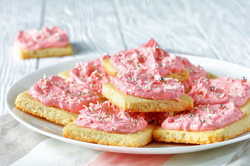 shortbread cookies with pink frosting, top view