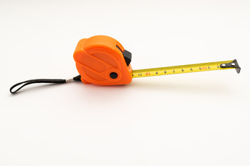 orange plastic construction tape measure on white background