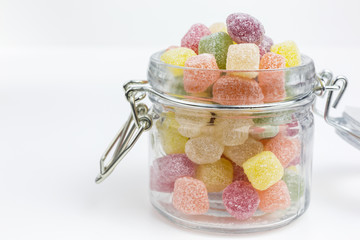 fruity gummy candy in a glass jar - 304375337