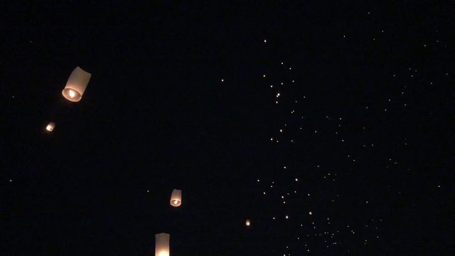 Release floating lanterns in the night sky. Launching Sky Lantern  rise festival of lights. Yee Peng Festival, Loy Krathong celebration in ChiangMai,Thailand