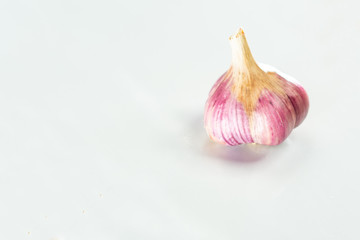 Head of dried blue garlic on a white background.