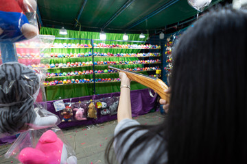 women playing shooting games at Fair Carnival