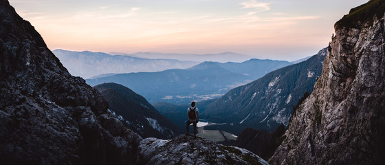 Breathtaking Views From Mangart Peak at Stunning Sunset. Peaks Above Clouds.