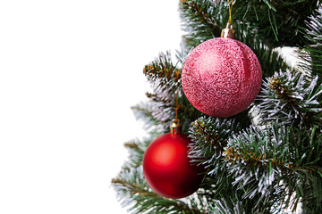 New Year background. Isolated Christmas ball on branch of spruce tree