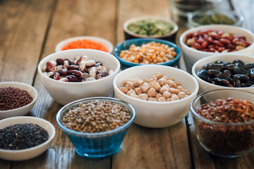 Super food. Seeds and beans assortment on a rustic background copy space. Vegetarians.