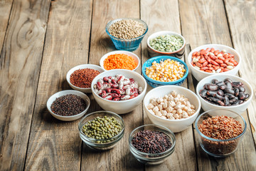 Super food. Seeds and beans assortment on a rustic background copy space. Vegetarians.