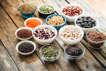 Super food. Seeds and beans assortment on a rustic background copy space. Vegetarians.